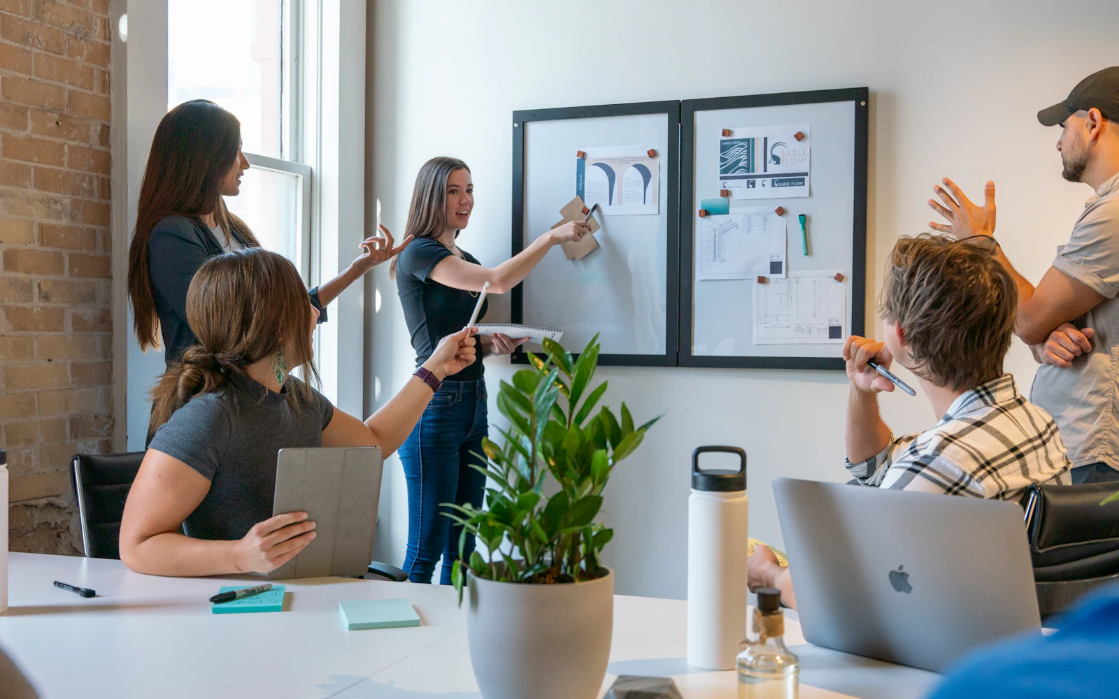 Colleagues in a discussion around a table in an office